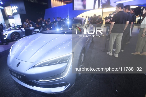 Visitors look at the newly released YANGWANG U7 luxury sedan at the Guangzhou Auto Show in Guangzhou, China, on November 15, 2024. 