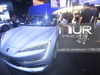 Visitors look at the newly released YANGWANG U7 luxury sedan at the Guangzhou Auto Show in Guangzhou, China, on November 15, 2024. (