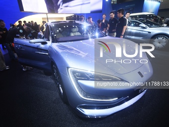 Visitors look at the newly released YANGWANG U7 luxury sedan at the Guangzhou Auto Show in Guangzhou, China, on November 15, 2024. (