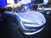 Visitors look at the newly released YANGWANG U7 luxury sedan at the Guangzhou Auto Show in Guangzhou, China, on November 15, 2024. (