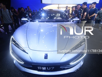 Visitors look at the newly released YANGWANG U7 luxury sedan at the Guangzhou Auto Show in Guangzhou, China, on November 15, 2024. (