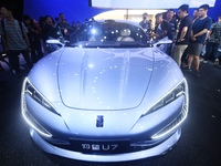 Visitors look at the newly released YANGWANG U7 luxury sedan at the Guangzhou Auto Show in Guangzhou, China, on November 15, 2024. (