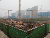 Workers work at a housing project site in Xi'an, Shaanxi province, China, on November 12, 2024. (