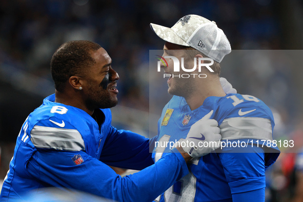 DETROIT,MICHIGAN-November 17: Detroit Lions quarterback Jared Goff (16) celebrates with wide receiver Allen Robinson (8) after a touchdown d...