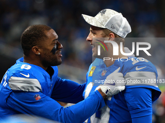 DETROIT,MICHIGAN-November 17: Detroit Lions quarterback Jared Goff (16) celebrates with wide receiver Allen Robinson (8) after a touchdown d...