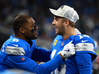 DETROIT,MICHIGAN-November 17: Detroit Lions quarterback Jared Goff (16) celebrates with wide receiver Allen Robinson (8) after a touchdown d...