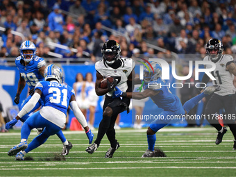 DETROIT,MICHIGAN-November 17: Jacksonville Jaguars wide receiver Brian Thomas Jr. (7) runs the ball during the second half of an NFL footbal...