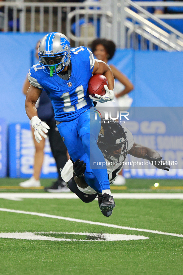 DETROIT,MICHIGAN-November 17: Detroit Lions wide receiver Kalif Raymond (11) runs the ball against Jacksonville Jaguars wide receiver Tim Jo...