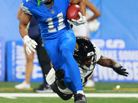 DETROIT,MICHIGAN-November 17: Detroit Lions wide receiver Kalif Raymond (11) runs the ball against Jacksonville Jaguars wide receiver Tim Jo...