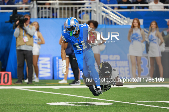 DETROIT,MICHIGAN-November 17: Detroit Lions wide receiver Kalif Raymond (11) runs the ball against Jacksonville Jaguars wide receiver Tim Jo...