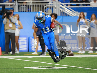 DETROIT,MICHIGAN-November 17: Detroit Lions wide receiver Kalif Raymond (11) runs the ball against Jacksonville Jaguars wide receiver Tim Jo...