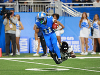 DETROIT,MICHIGAN-November 17: Detroit Lions wide receiver Kalif Raymond (11) runs the ball against Jacksonville Jaguars wide receiver Tim Jo...