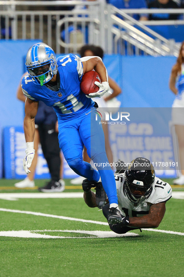 DETROIT,MICHIGAN-November 17: Detroit Lions wide receiver Kalif Raymond (11) runs the ball against Jacksonville Jaguars wide receiver Tim Jo...