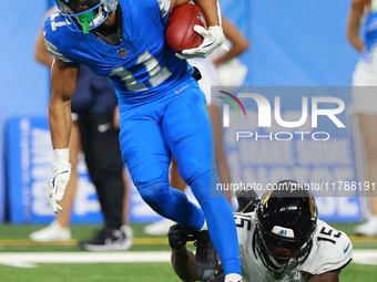 DETROIT,MICHIGAN-November 17: Detroit Lions wide receiver Kalif Raymond (11) runs the ball against Jacksonville Jaguars wide receiver Tim Jo...