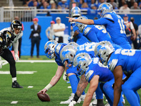 DETROIT,MICHIGAN-November 17: Detroit Lions quarterback Jared Goff (16) signlas before the snap during the second half of an NFL football ga...