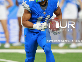 DETROIT,MICHIGAN-November 17: Detroit Lions wide receiver Kalif Raymond (11) runs the ball during the second half of an NFL football game be...