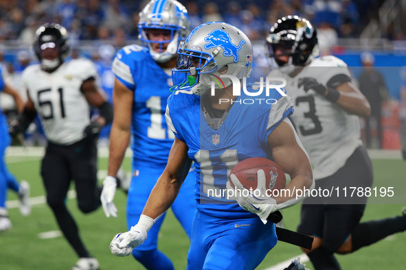 DETROIT,MICHIGAN-November 17: Detroit Lions wide receiver Kalif Raymond (11) runs the ball during the second half of an NFL football game be...