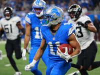 DETROIT,MICHIGAN-November 17: Detroit Lions wide receiver Kalif Raymond (11) runs the ball during the second half of an NFL football game be...