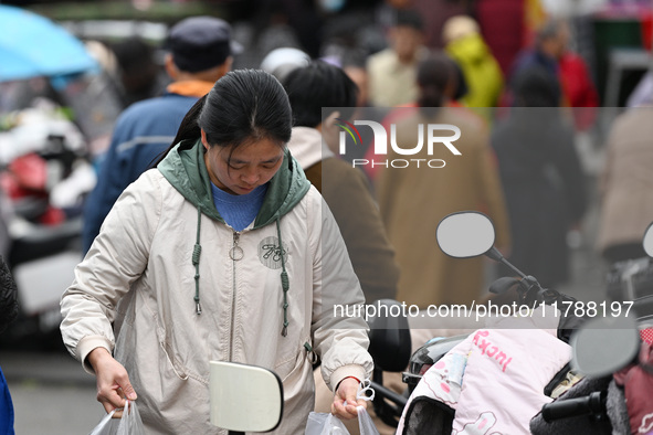 Citizens shop at a farmer's market in Nanjing, China, on November 18, 2024. 