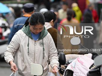 Citizens shop at a farmer's market in Nanjing, China, on November 18, 2024. (