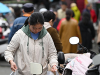 Citizens shop at a farmer's market in Nanjing, China, on November 18, 2024. (