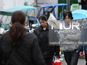 Citizens shop at a farmer's market in Nanjing, China, on November 18, 2024. (