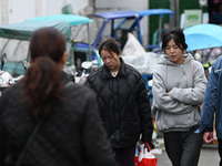 Citizens shop at a farmer's market in Nanjing, China, on November 18, 2024. (