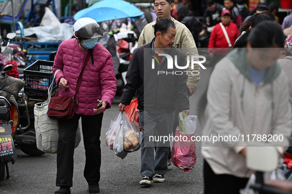 Citizens shop at a farmer's market in Nanjing, China, on November 18, 2024. 