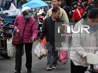 Citizens shop at a farmer's market in Nanjing, China, on November 18, 2024. (