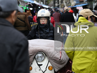 Citizens shop at a farmer's market in Nanjing, China, on November 18, 2024. (