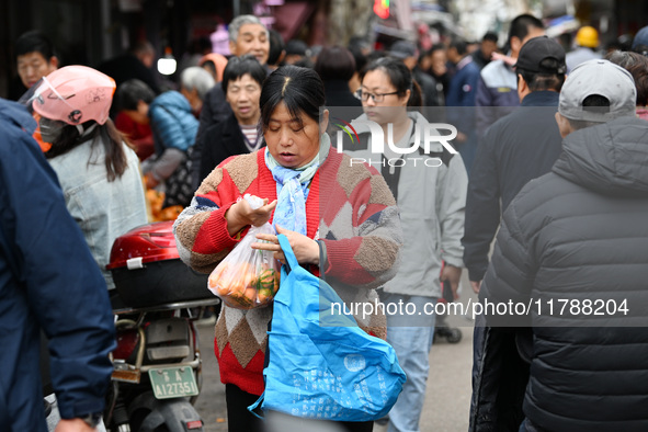 Citizens shop at a farmer's market in Nanjing, China, on November 18, 2024. 