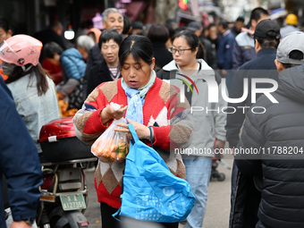 Citizens shop at a farmer's market in Nanjing, China, on November 18, 2024. (