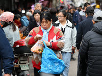 Citizens shop at a farmer's market in Nanjing, China, on November 18, 2024. (