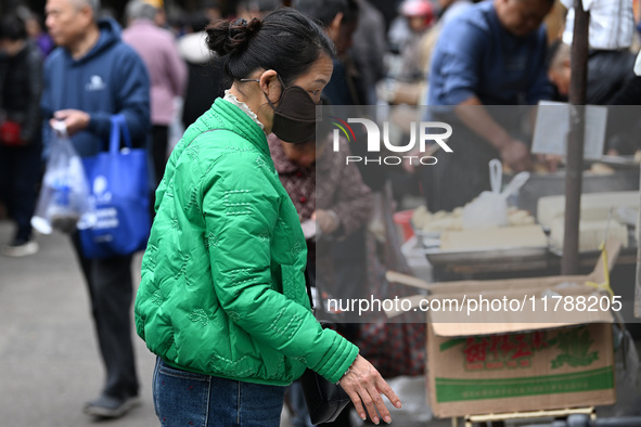 Citizens shop at a farmer's market in Nanjing, China, on November 18, 2024. 