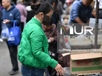 Citizens shop at a farmer's market in Nanjing, China, on November 18, 2024. (