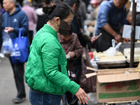 Citizens shop at a farmer's market in Nanjing, China, on November 18, 2024. (