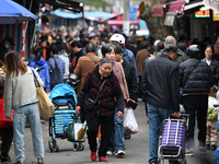 Citizens shop at a farmer's market in Nanjing, China, on November 18, 2024. (