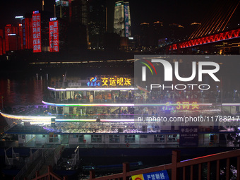 Tourists visit the Hong Ya Dong scenic area in Chongqing, China, on November 7, 2024. (