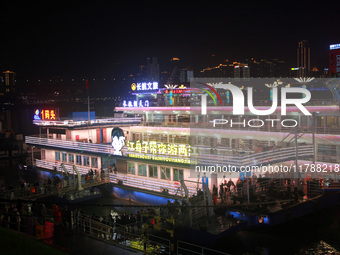 Tourists visit the Hong Ya Dong scenic area in Chongqing, China, on November 7, 2024. (