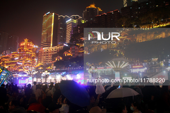 Tourists visit the Hong Ya Dong scenic area in Chongqing, China, on November 7, 2024. 