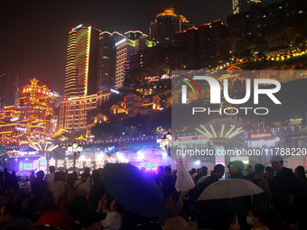 Tourists visit the Hong Ya Dong scenic area in Chongqing, China, on November 7, 2024. (