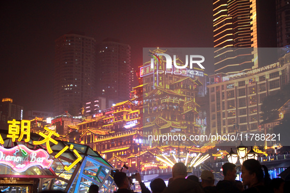 Tourists visit the Hong Ya Dong scenic area in Chongqing, China, on November 7, 2024. 