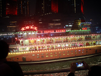 Tourists visit the Hong Ya Dong scenic area in Chongqing, China, on November 7, 2024. (