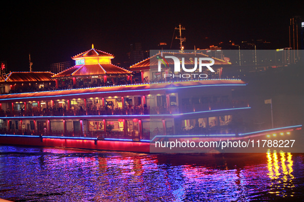 Tourists visit the Hong Ya Dong scenic area in Chongqing, China, on November 7, 2024. 