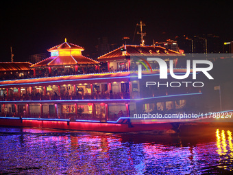 Tourists visit the Hong Ya Dong scenic area in Chongqing, China, on November 7, 2024. (