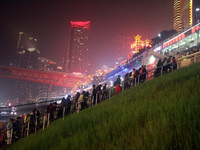 Tourists visit the Hong Ya Dong scenic area in Chongqing, China, on November 7, 2024. (