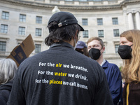 Environmental activists rally to demand climate action before US President-elect Donald Trump takes office in Washington, DC, on November 17...