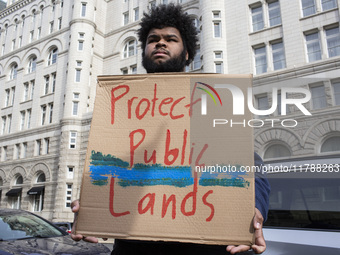 Environmental activists rally to demand climate action before US President-elect Donald Trump takes office in Washington, DC, on November 17...