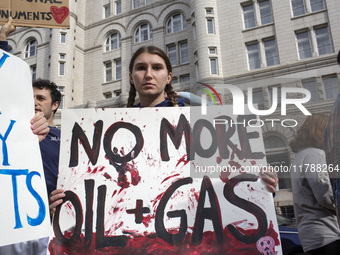 Environmental activists rally to demand climate action before US President-elect Donald Trump takes office in Washington, DC, on November 17...