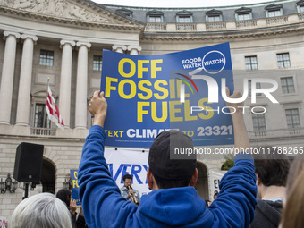 Environmental activists rally to demand climate action before US President-elect Donald Trump takes office in Washington, DC, on November 17...